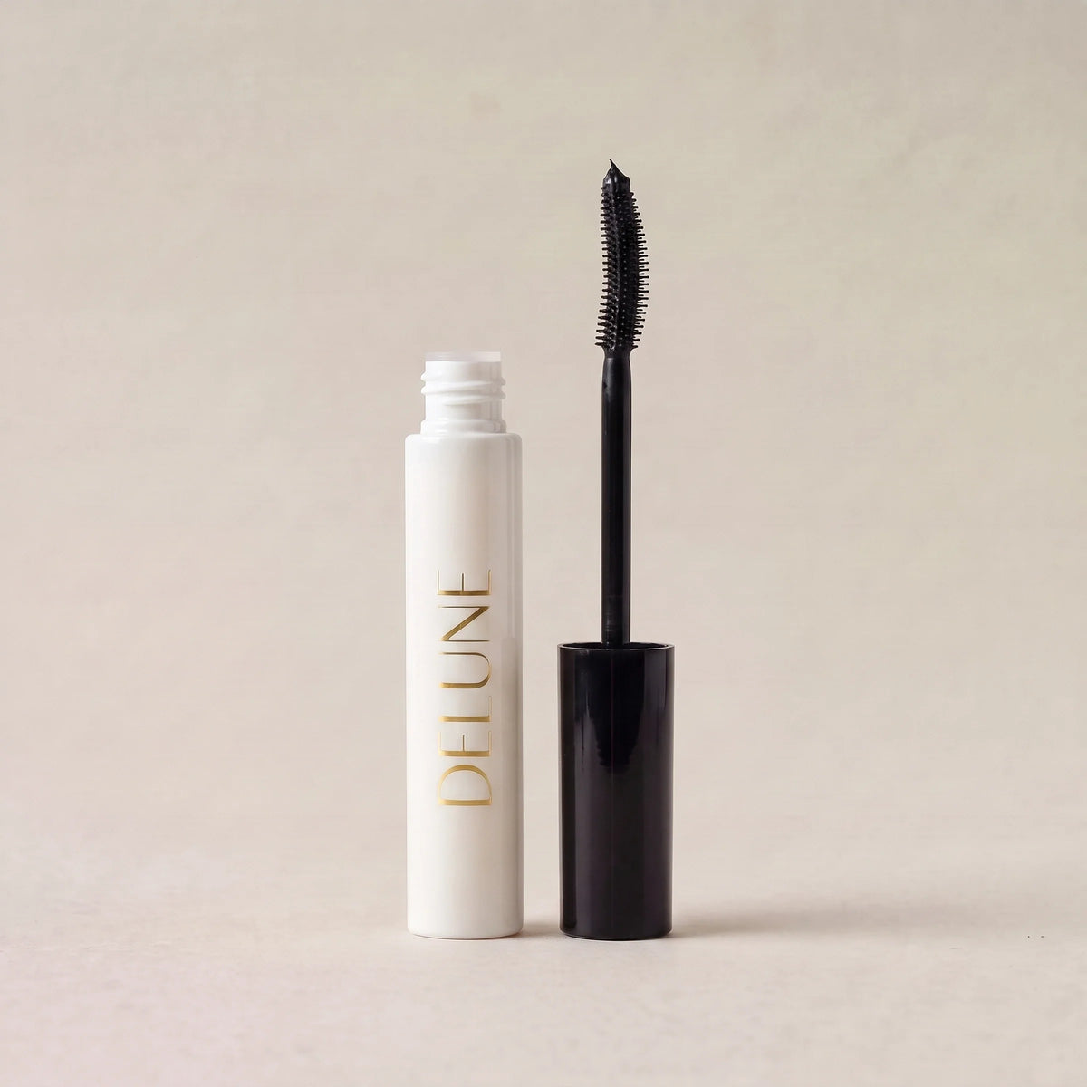 Delune Tubing Mascara, open with curved brush wand
