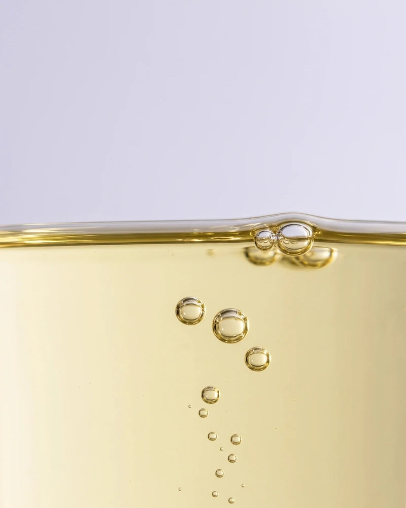 Calm 49% Marula Oil Serum texture: clear pale golden marula oil with gently rising bubbles