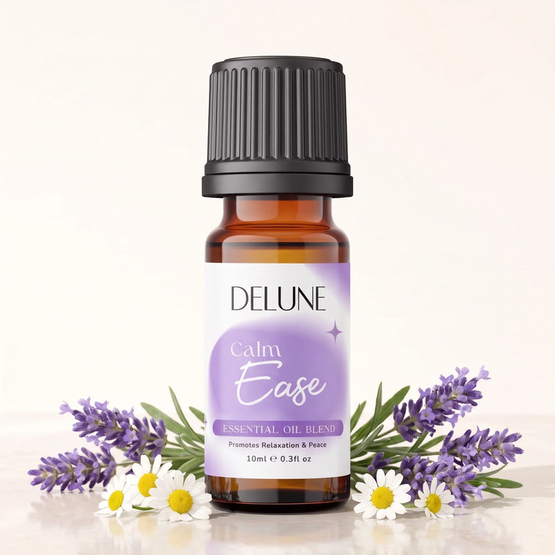 Delune Calm Ease Essential Oil Blend 10ml amber glass bottle with fresh lavender and chamomile flowers