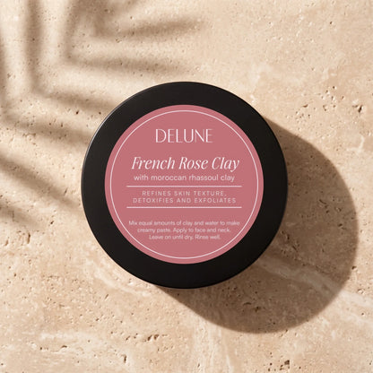 Delune French Rose Clay Mask jar from above on warm travertine in soft window light