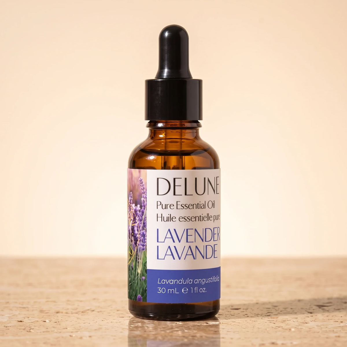 Delune Lavender (Bulgarian) Pure Essential Oil, 30ml amber glass dropper bottle on warm travertine stone