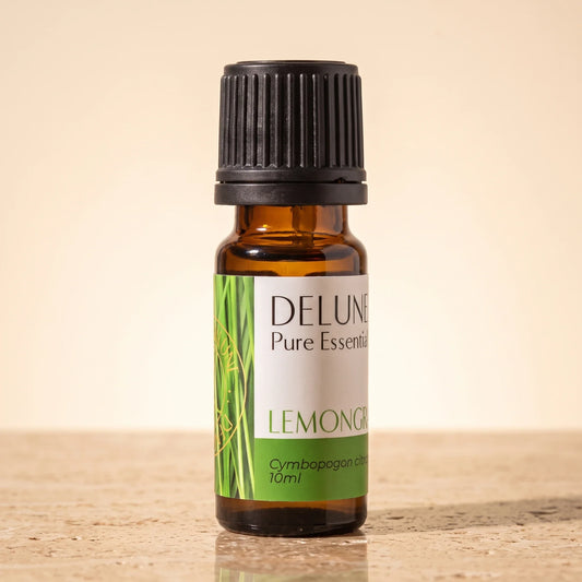 Delune Lemongrass Pure Essential Oil, 10ml amber glass bottle on warm travertine stone