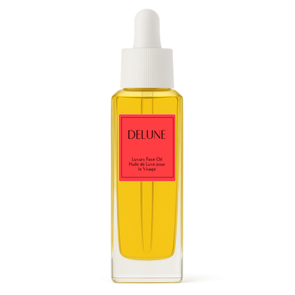 Delune Geranium & Orange Blossom luxury face oil in a glass bottle with dropper, promising soft and silky smooth skin.